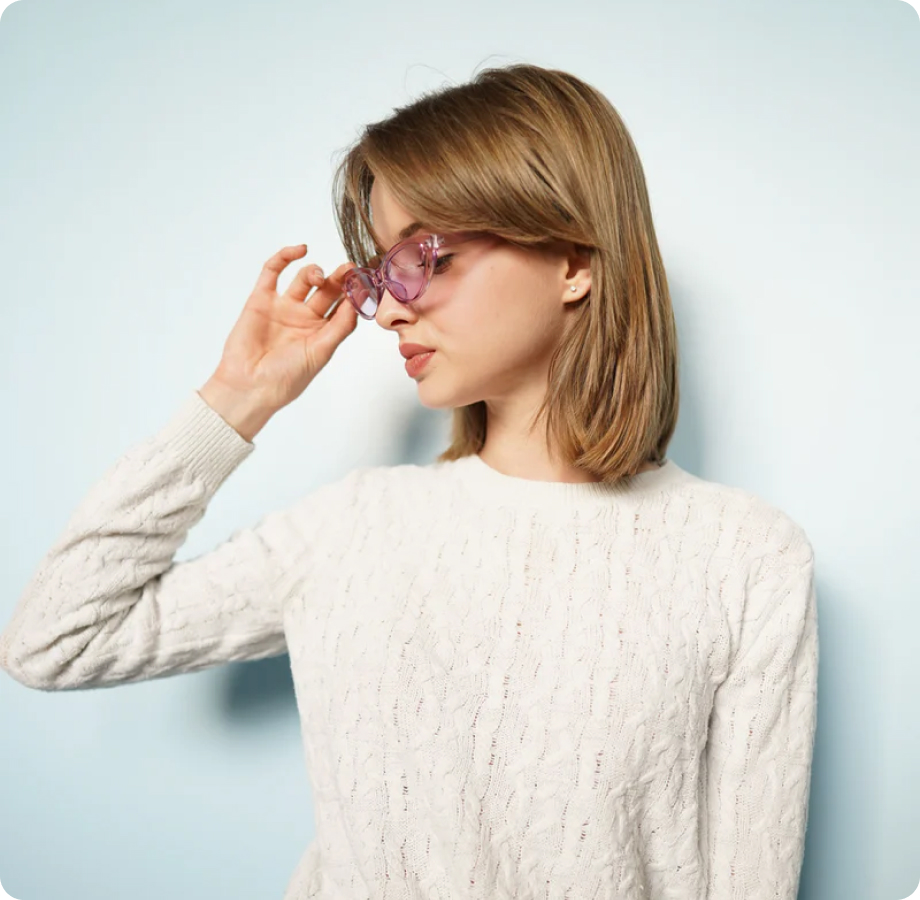 Woman adjusting glasses