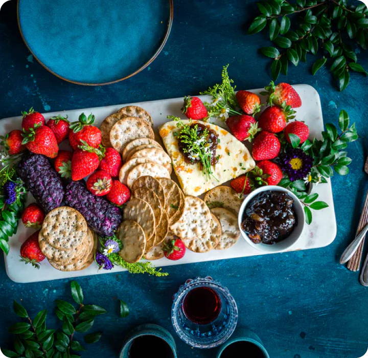 A platter with fruit and crackers