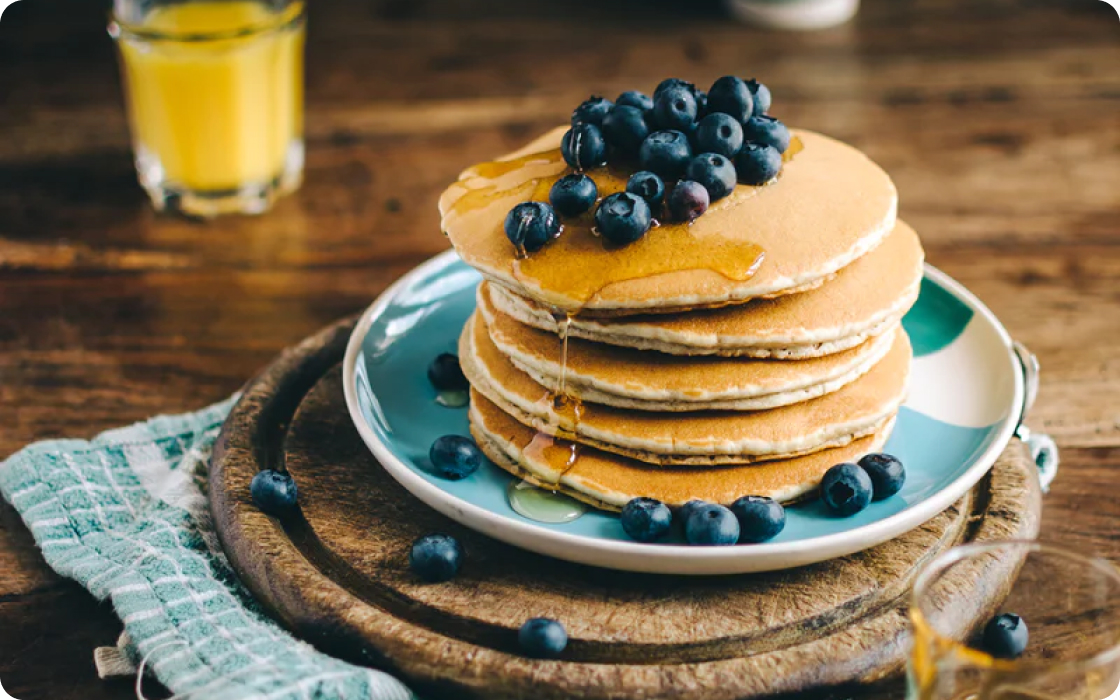 Classic pancakes with blueberries and maple syrup